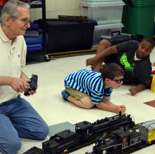 community volunteers playing with students
